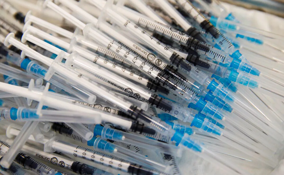 Syringes with the Pfizer-BioNTech vaccines lie on a tray during a program without an appointment, in Sant Vicenc de Castellet, north of Barcelona, Spain, on July 6, 2021. (Albert Gea/Reuters)