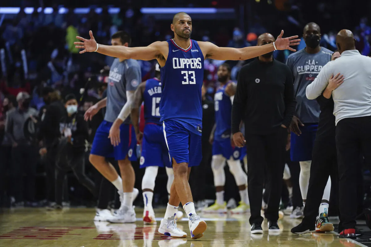Los Angeles Clippers forward Nicolas Batum (33) celebrates after a 117-109 win over the Portland Trail Blazers in an NBA basketball game in Los Angeles on Nov. 9, 2021. (AP Photo/Ashley Landis)
