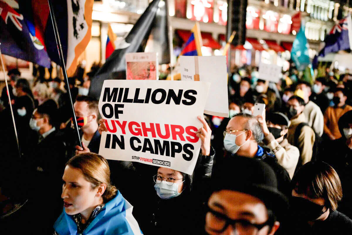 Demonstrators supporting Tibetans, Uyghurs, and Hong Kongers take part in a protest against the Chinese Communist Party as they march along Regent Street towards the Chinese Embassy in London, on Oct. 1, 2021. (Matt Dunham/AP Photo)