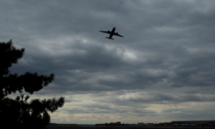 A passenger jet lifts off at Reagan National Airport, with the control tower seen at lower right. (Gary Cameron/Reuters)