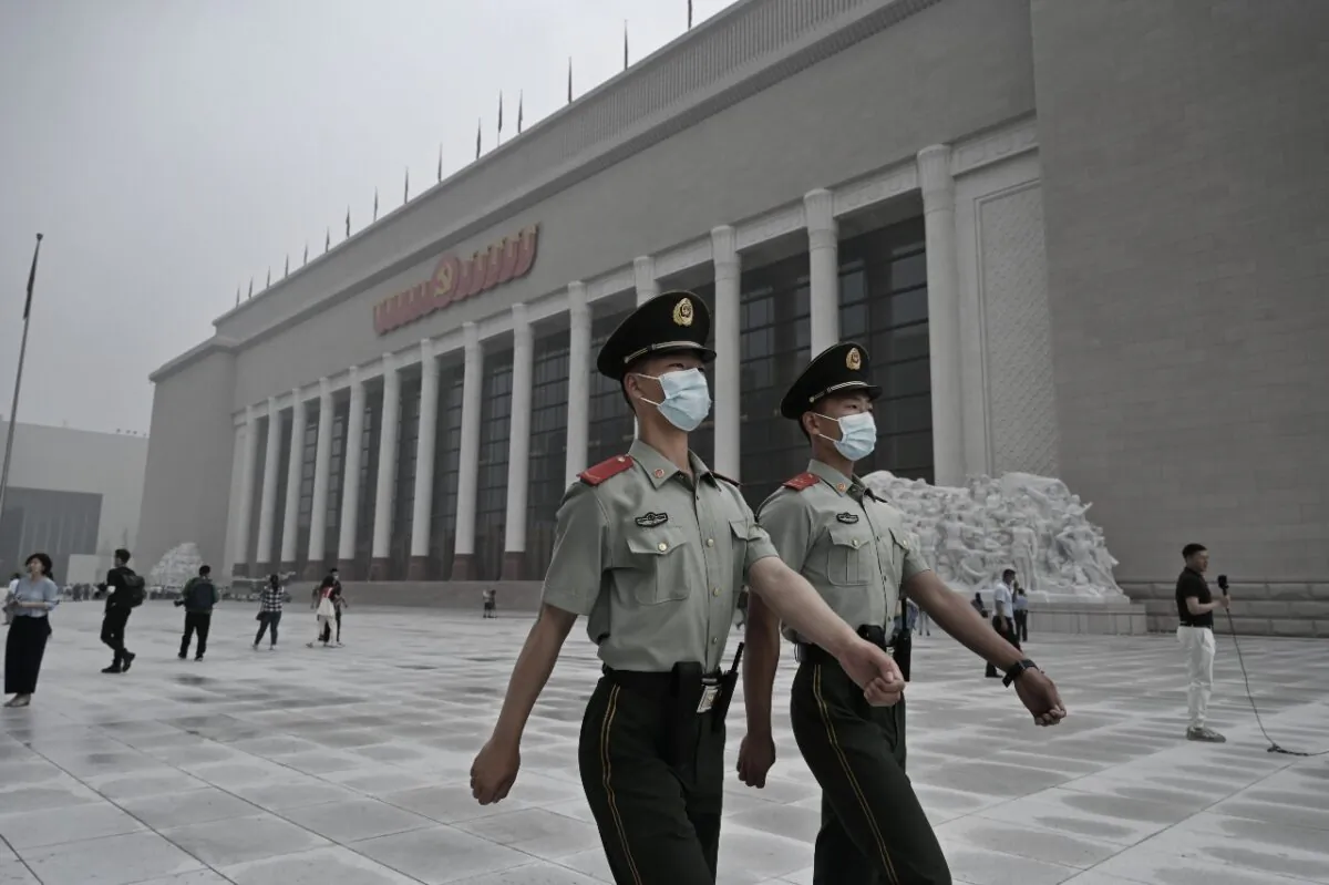 Chinese police officers walk outside the newly built Museum of the Communist Party of China on June 25, 2021 in Beijing, China. (Kevin Frayer/Getty Images)