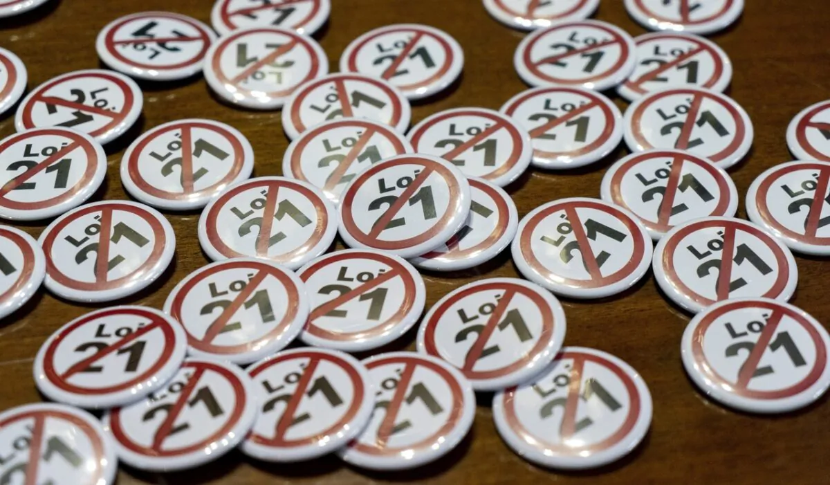Badges are seen as part of a campaign in opposition to Quebec's secularism Bill 21 during a news conference in Montreal on Sept. 5, 2019. (The Canadian Press/Paul Chiasson)