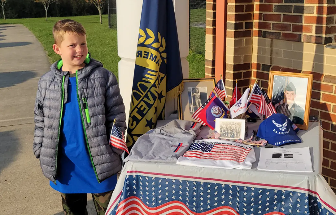 Austin Riddell, a fourth-grader at Redbud Run Elementary School in Winchester, Va., at a Veterans Day event he puts together with his mother, on Nov. 11, 2021. (Courtesy of Pegah Fowler)