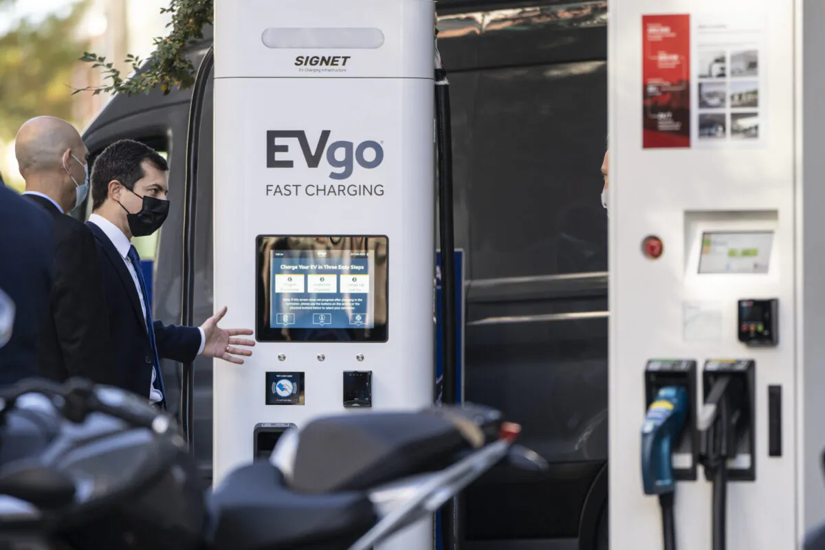 Secretary of Transportation Pete Buttigieg looks at an EVgo charging station during an electric vehicles event outside the Department of Transportation in Washington on Oct. 20, 2021. (Drew Angerer/Getty Images)
