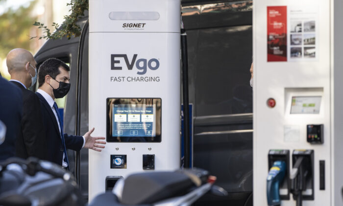 U.S. Secretary of Transportation Pete Buttigieg looks at an EVgo charging station during an electric vehicles event outside of the Department of Transportation in Washington, DC on Oct. 20, 2021. (Drew Angerer/Getty Images)