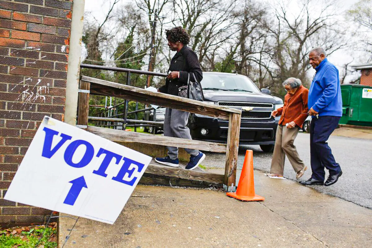 Voter enters a polling station at Floyd Middle Magnet School during the Democratic presidential primary in Montgomery, Alabama, on March 3, 2020. (Joshua Lott/AFP via Getty Images)