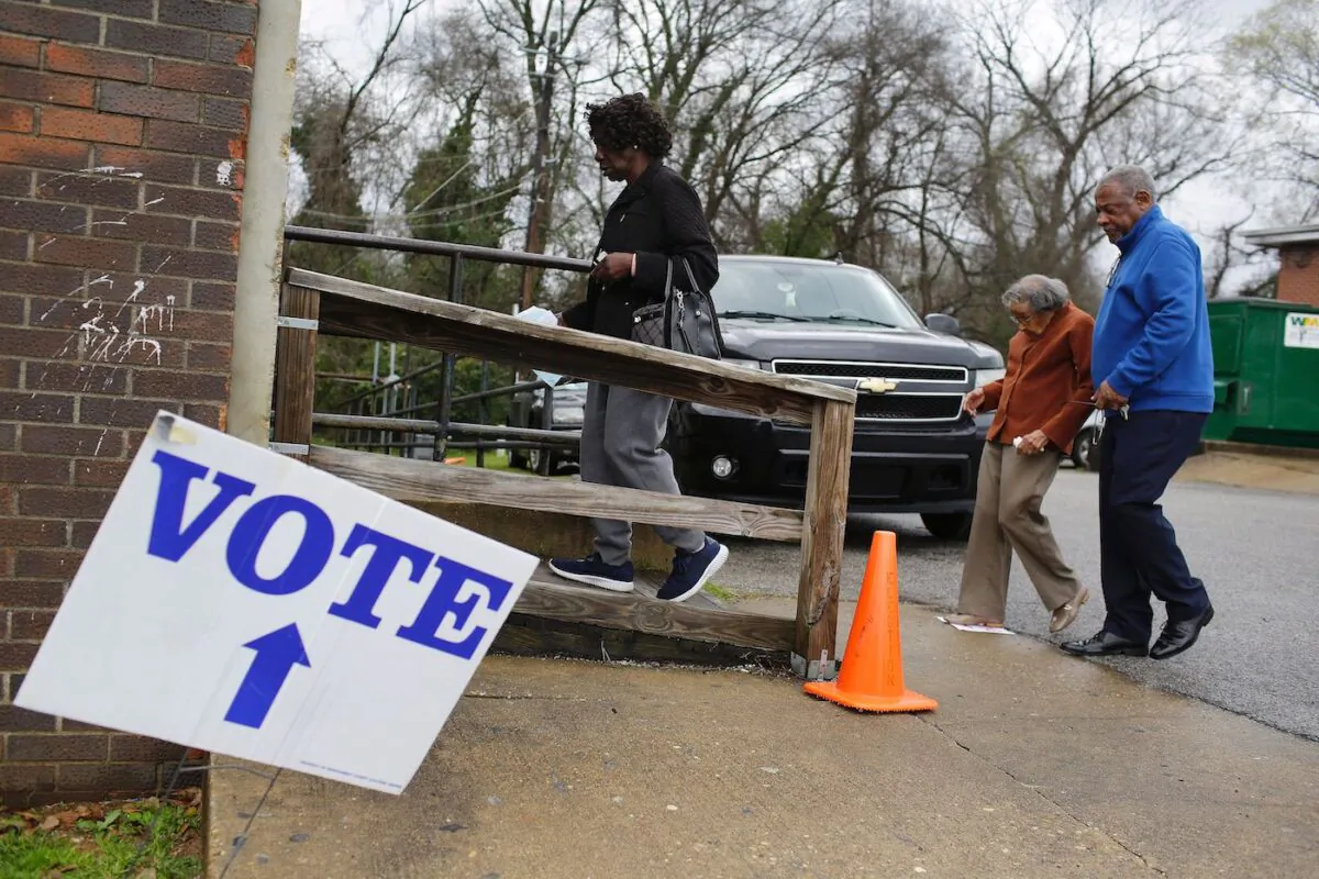 Voter enters a polling station at Floyd Middle Magnet School during the Democratic presidential primary in Montgomery, Alabama, on March 3, 2020. (Joshua Lott/AFP via Getty Images)