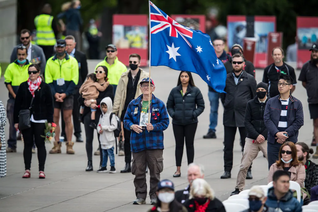 Members of the public look on during the Remembrance Day service in Melbourne, Australia, on Nov. 11, 2021. (Darrian Traynor/Getty Images)