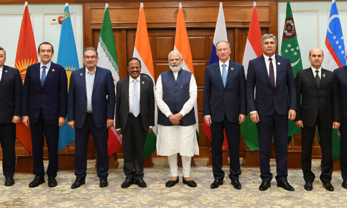 Indian Prime Minister, Narendra Modi with the national security advisors of seven countries, in New Delhi on Nov. 10, 2021. India hosted the 8-national regional security dialogue on Afghanistan on Wednesday. (Picture Courtesy Press Bureau of India)