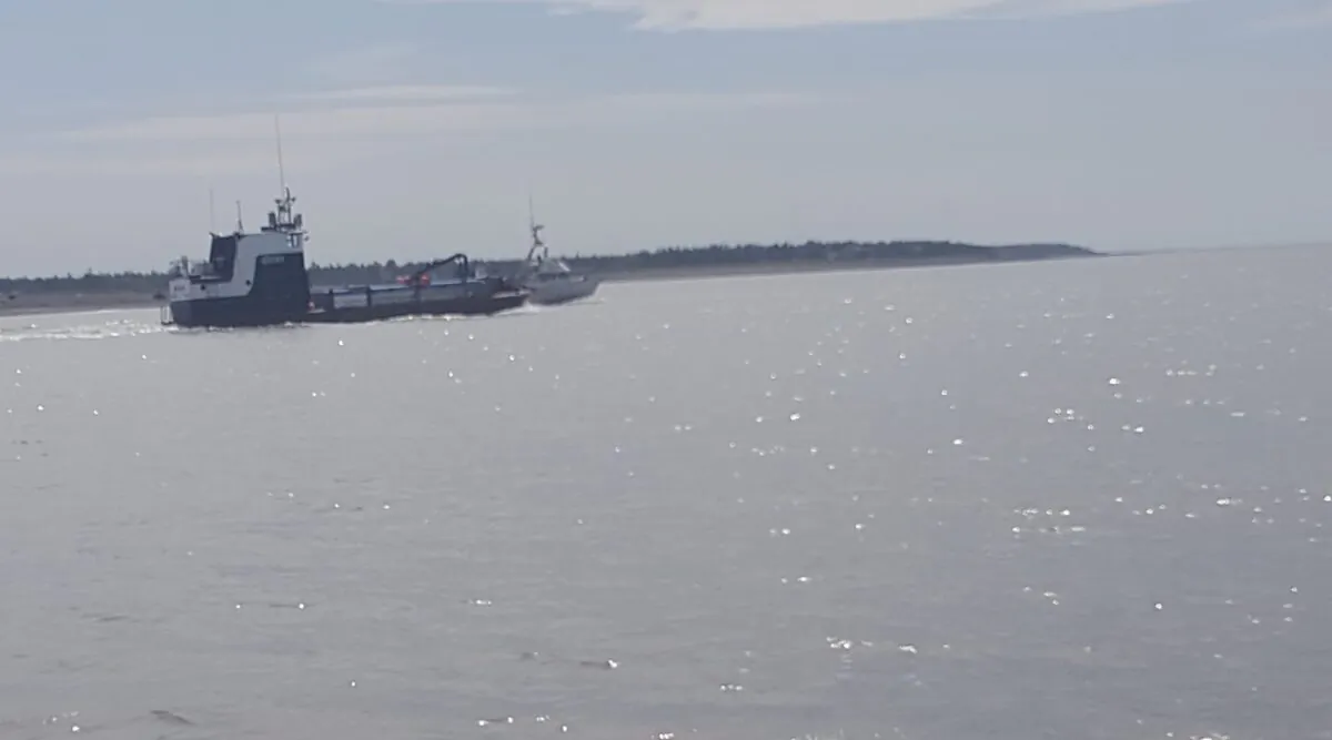 Fishing boats entering Cook Inlet via the Kenai River, Kenai, Alaska, on July 1, 2020. (Beeblebrox via Wikimedia Commons/CC BY-SA 4.0)