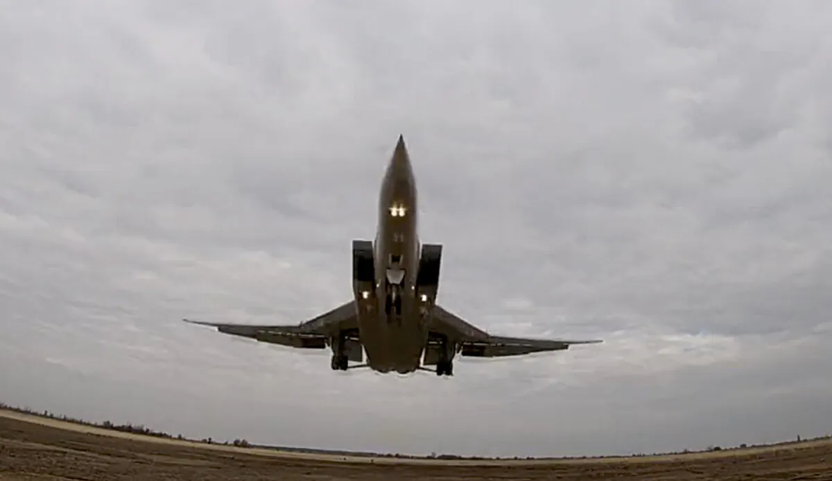 In this handout photo taken from video released by Russian Defense Ministry Press Service on Wed. Nov. 10, 2021, a long-range Tu-22M3 bomber of the Russian Aerospace Forces takes-off to patrol in the airspace of Belarus, (Russian Defense Ministry Press Service via AP)