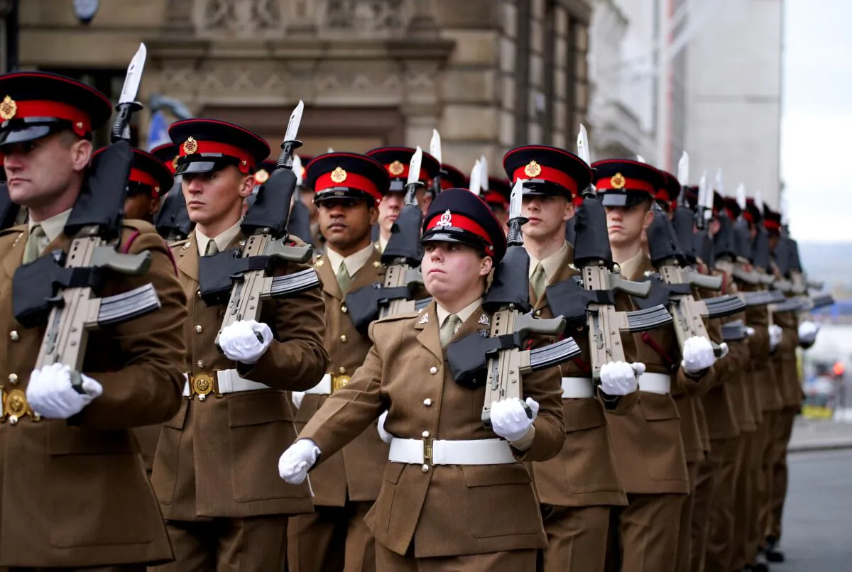 1st Battalion of The Duke Of Lancaster’s Regiment march through the streets of Liverpool before observing a two minute silence to remember the war dead on Armistice Day, Nov. 11, 2021. (PA)