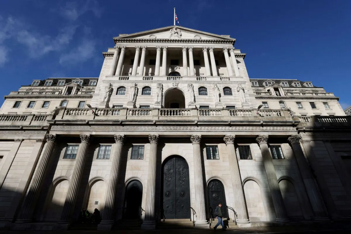 A person walks past the Bank of England, in London, on Oct. 31, 2021. (Tom Nicholson/Reuters)