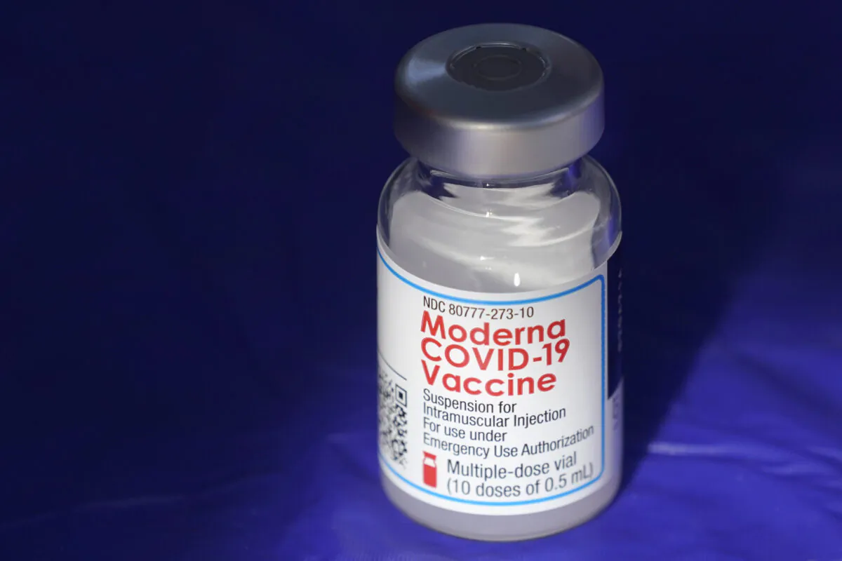 A vial of the Moderna COVID-19 vaccine rests on a table at a clinic in Puyallup, Wash., on March 4, 2021. (Ted S. Warren/AP Photo)