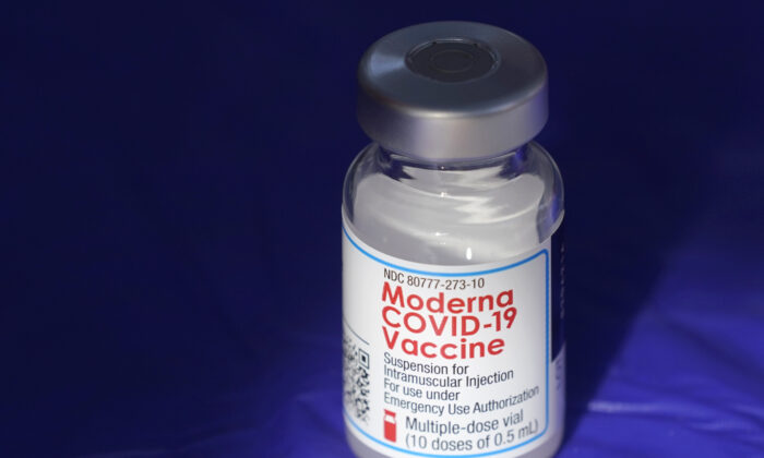 A vial of the Moderna COVID-19 vaccine rests on a table at a clinic in Puyallup, Wash., on March 4, 2021. (Ted S. Warren/AP Photo)
