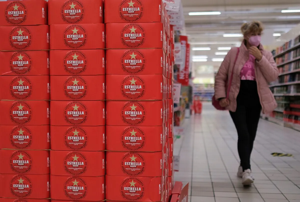 Boxes with Estrella Damm beer are seen inside a supermarket in Ferrol, Spain, on Nov. 12, 2021. (Nacho Doce/Reuters)