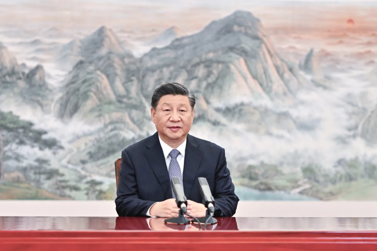 Chinese President Xi Jinping delivers a keynote speech for the Asia-Pacific Economic Cooperation (APEC) CEO Summit via video, from Beijing on Nov. 11, 2021. (Li Xueren/Xinhua via AP)

