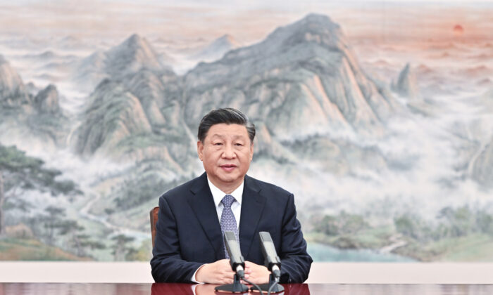 Chinese President Xi Jinping delivers a keynote speech for the Asia-Pacific Economic Cooperation (APEC) CEO Summit via video, from Beijing on Nov. 11, 2021. (Li Xueren/Xinhua via AP)


