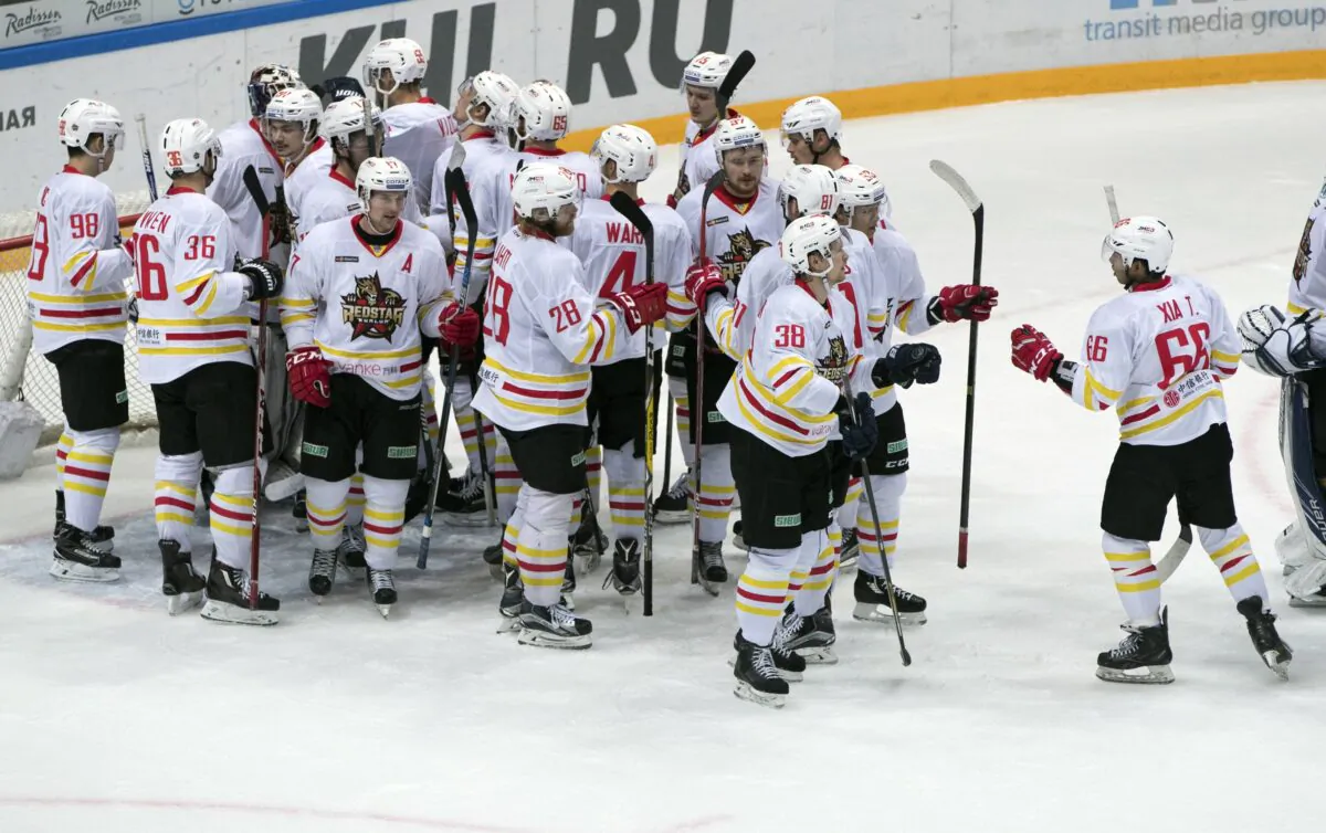 Kunlun Red Star's team players celebrate after they won the Kontinental Hockey League match against Spartak Moscow, in Moscow, Russia, on Oct. 1, 2016. (Pavel Golovkin/AP Photo)