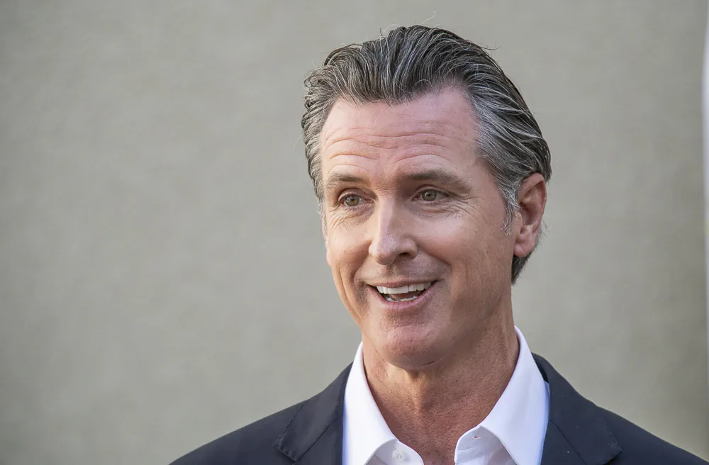 California Governor Gavin Newsom speaks with reporters at a VA facility in Brentwood, Calif., on Nov, 10, 2021. (John Fredricks/The Epoch Times)