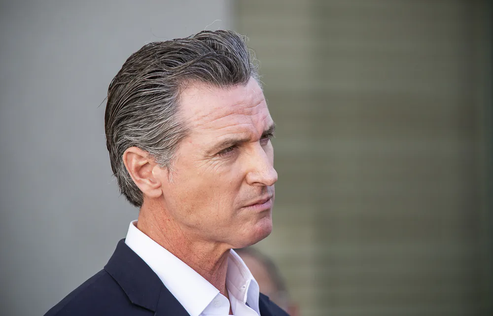California Gov. Gavin Newsom speaks with reporters at a VA facility in Brentwood, Calif., on Nov, 10, 2021. (John Fredricks/The Epoch Times)