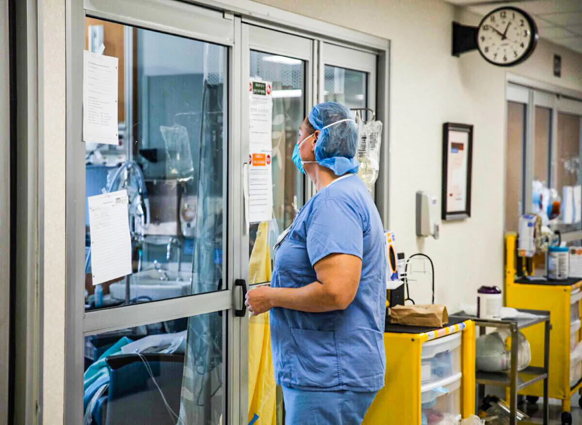 A health care professional prepares to enter a COVID-19 patient's room in an Ohio hospital in a file photograph. (Megan Jelinger/AFP via Getty Images) 