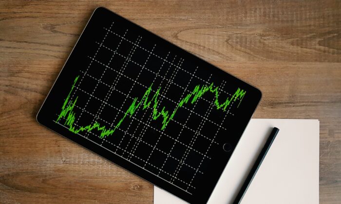 Stock photo of a tablet showing a stock price chart. (Burak Kebapci/Pexels)