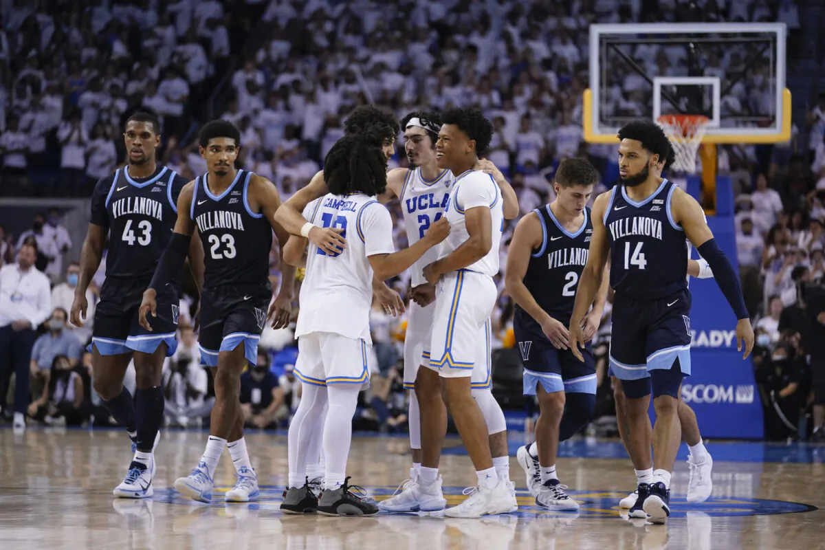 UCLA player huddle in the closing seconds of an overtime win over Villanova during an NCAA college basketball game  in Los Angeles, on Nov. 12, 2021. (Marcio Jose Sanchez/AP Photo)