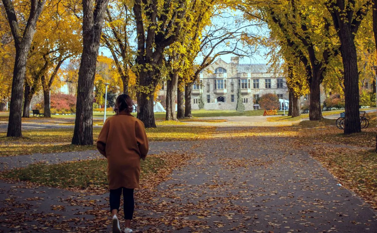 A woman walks on the University of Saskatchewan campus in Saskatoon, Saskatchewan, in a file photo. (Danial Damirchi/Shutterstock)