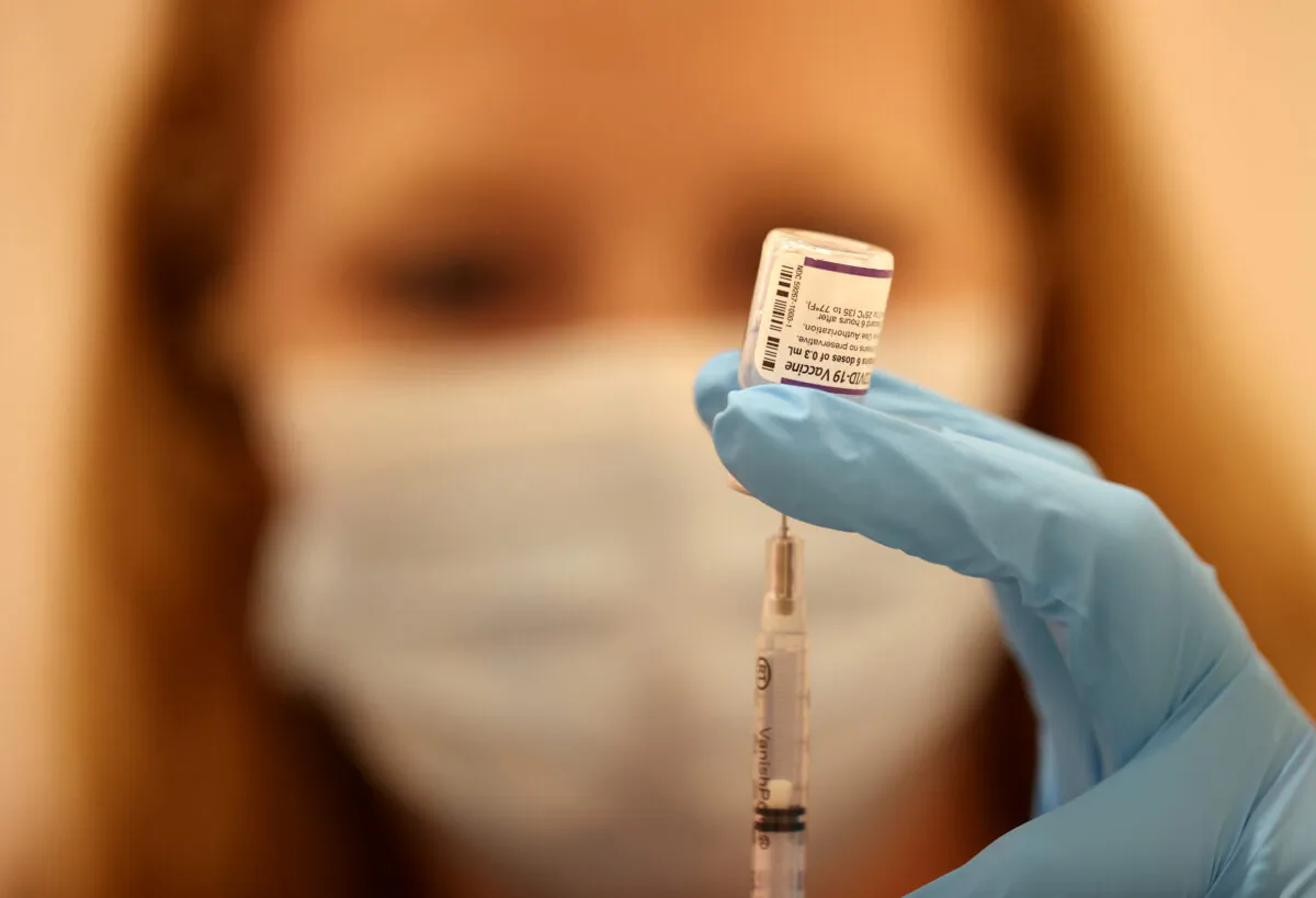 A pharmacist prepares a COVID-19 vaccine booster shot in San Rafael, Calif., on Oct. 1, 2021. (Justin Sullivan/Getty Images)