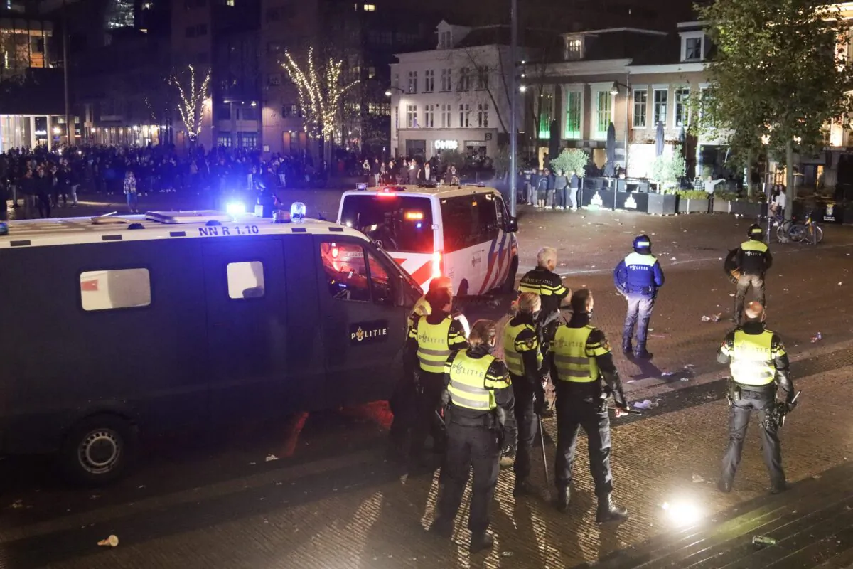 Dutch riot police deploy at Zaailand square to remove a large group of protesters in Leeuwarden on Nov. 13, 2021. (Anton Kappers/ANP/AFP via Getty Images)