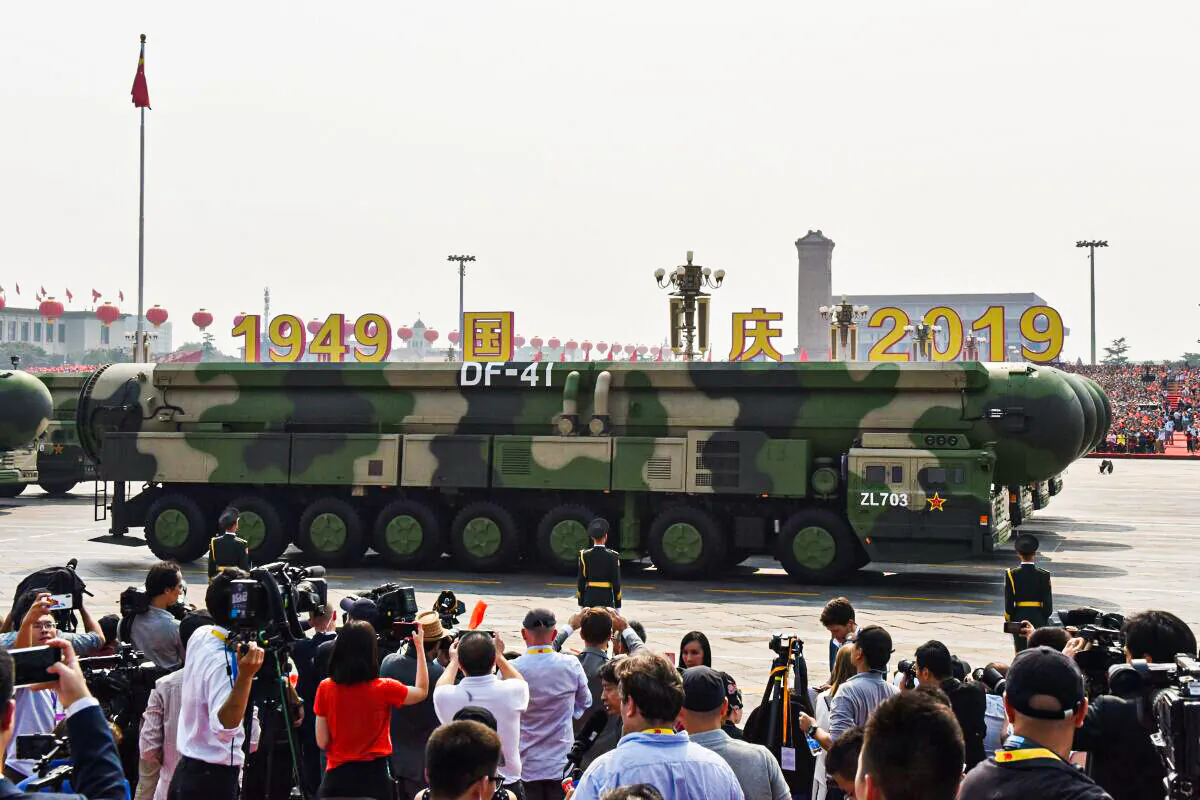 Military vehicles carry China's DF-41 nuclear-capable intercontinental ballistic missiles in a military parade at Tiananmen Square in Beijing on October 1, 2019, to mark the 70th anniversary of the founding of the People's Republic of China. (Photo by GREG BAKER / AFP) (Photo by GREG BAKER/AFP via Getty Images)