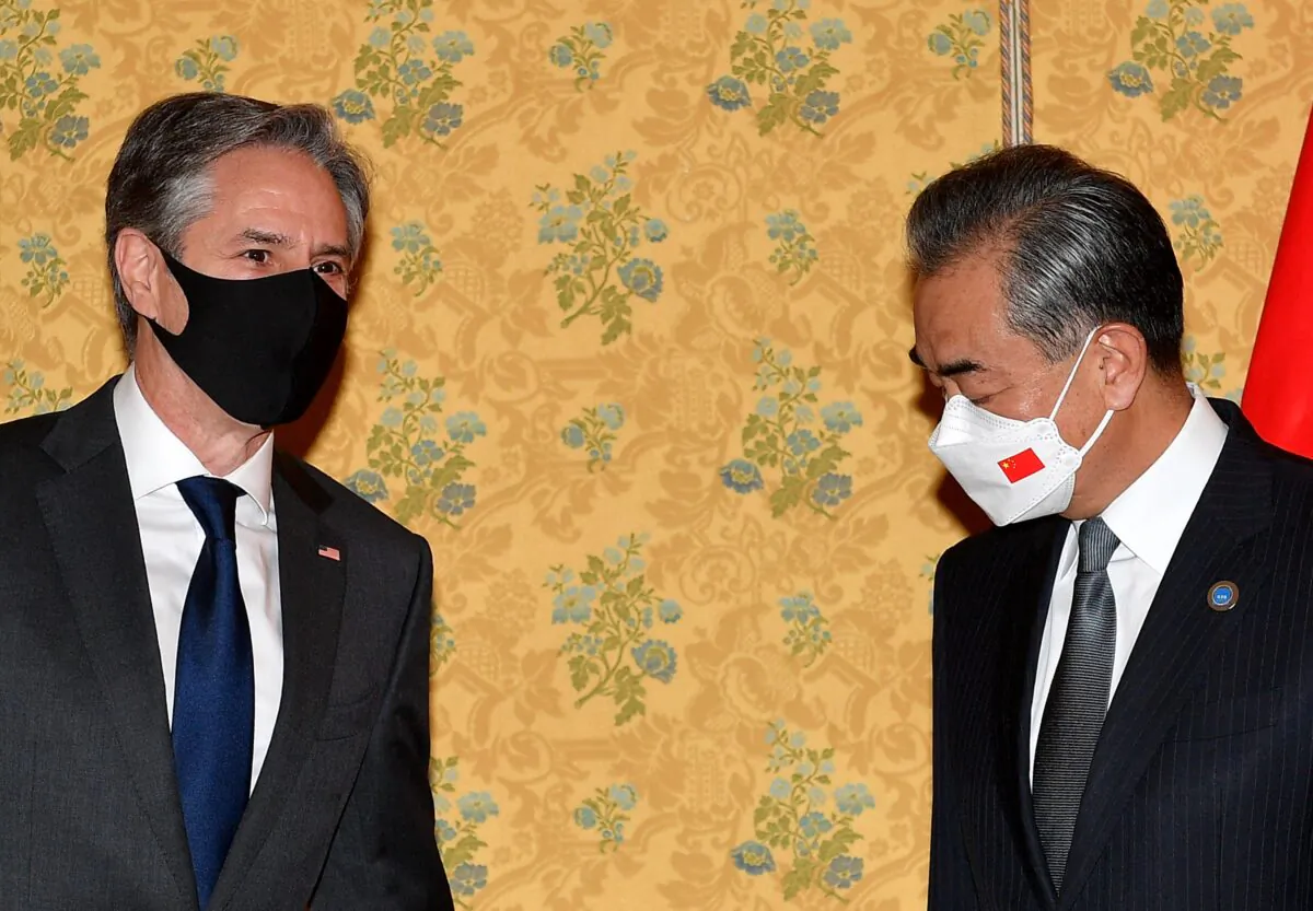 U.S. Secretary of State Antony Blinken and China's Foreign Minister Wang Yi meet at a hotel in Rome on the sidelines of the G-20 of World Leaders Summit of Rome, on Oct. 31, 2021. (Tiziana Fabi/POOL/AFP via Getty Images)