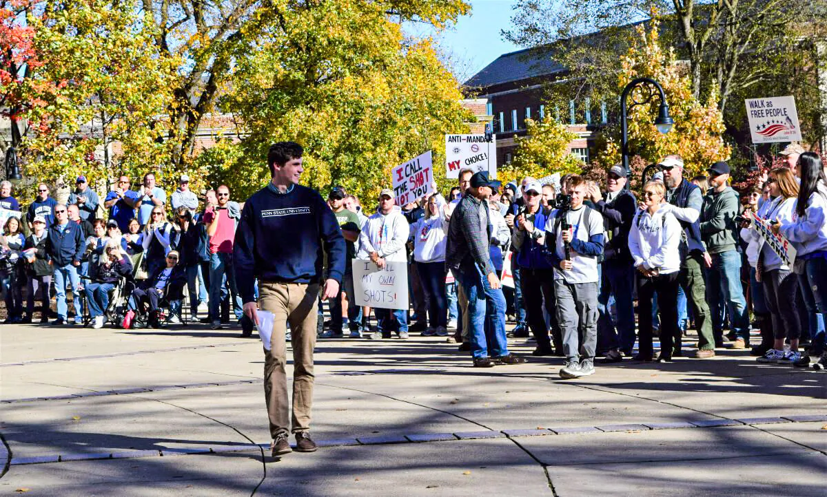Kevin McKenna, president of the Penn State University chapter of Turning Point USA energized the health freedom rally in front of Old Main on Penn State’s campus, Nov. 12, 2021. (Beth Brelje/The Epoch Times)   