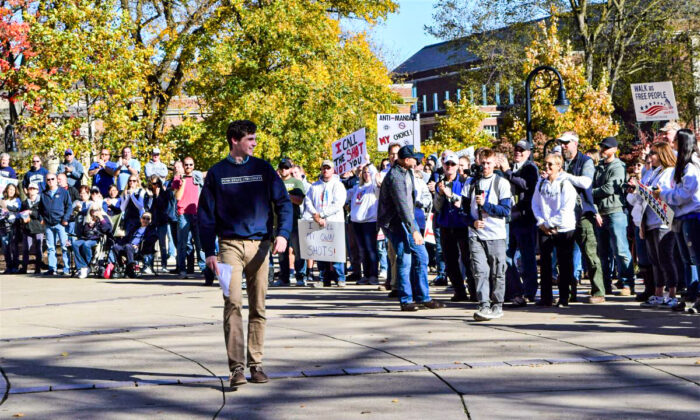 Kevin McKenna, president of the Penn State University chapter of Turning Point USA energized the health freedom rally in front of Old Main on Penn State’s campus, Nov. 12, 2021. (Beth Brelje/The Epoch Times)   