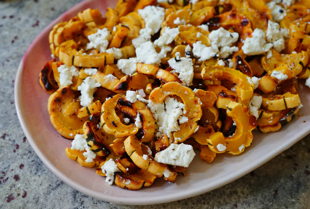 Roasted delicata squash can be the star of the show for vegetarians or a tasty side to an assortment of dishes. (EQRoy/Shutterstock)