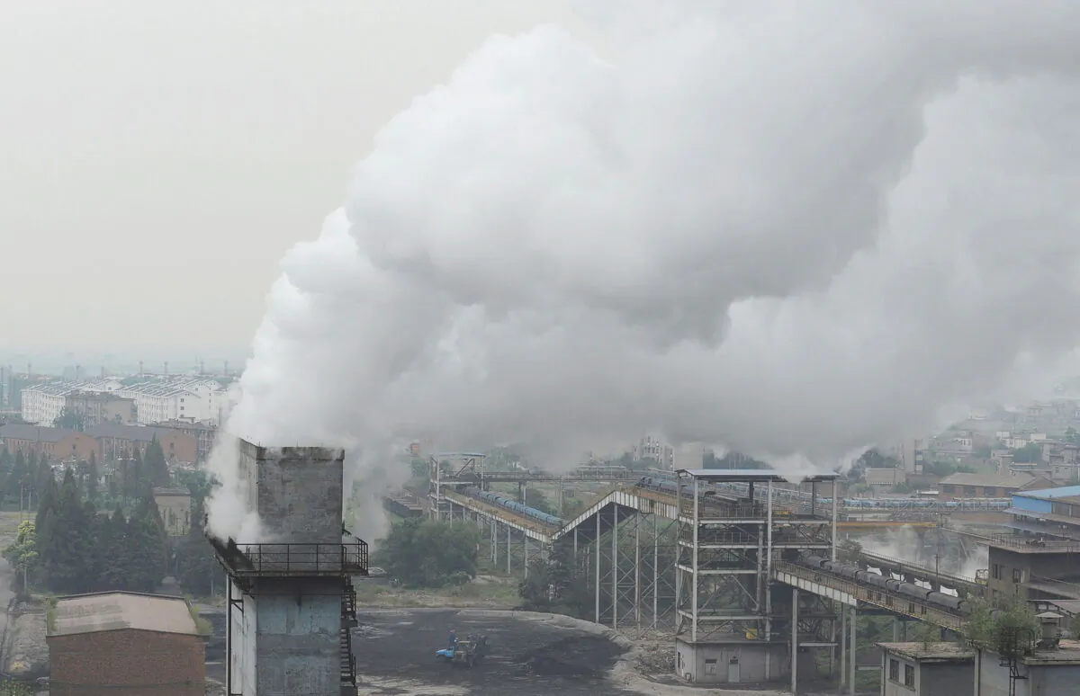 Smoke billows from a chimney at a coking factory in Hefei, Anhui province, China, on Oct. 2, 2010. (Stringer//Reuters)
