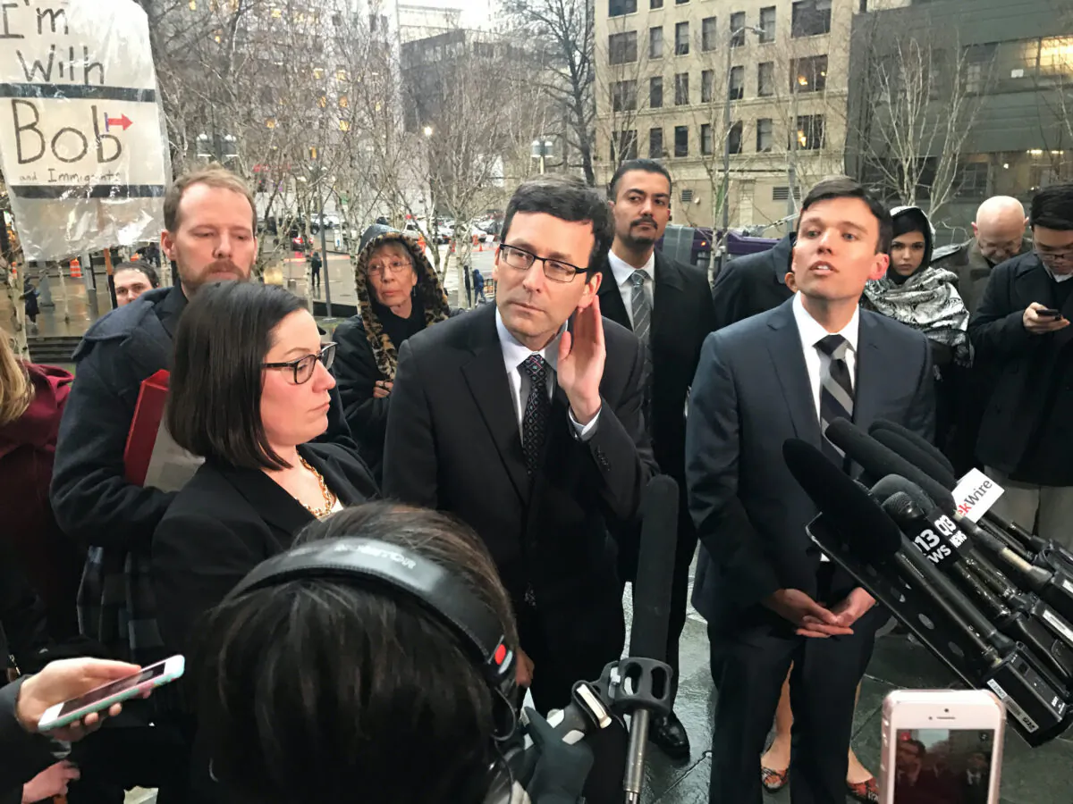 Washington state's attorney general Bob Ferguson (C) speaks to the media next to Washington state solicitor general Noah Purcell (R) outside the U.S. federal courthouse in downtown Seattle on Feb. 3, 2017. (Dan Levine/Reuters)