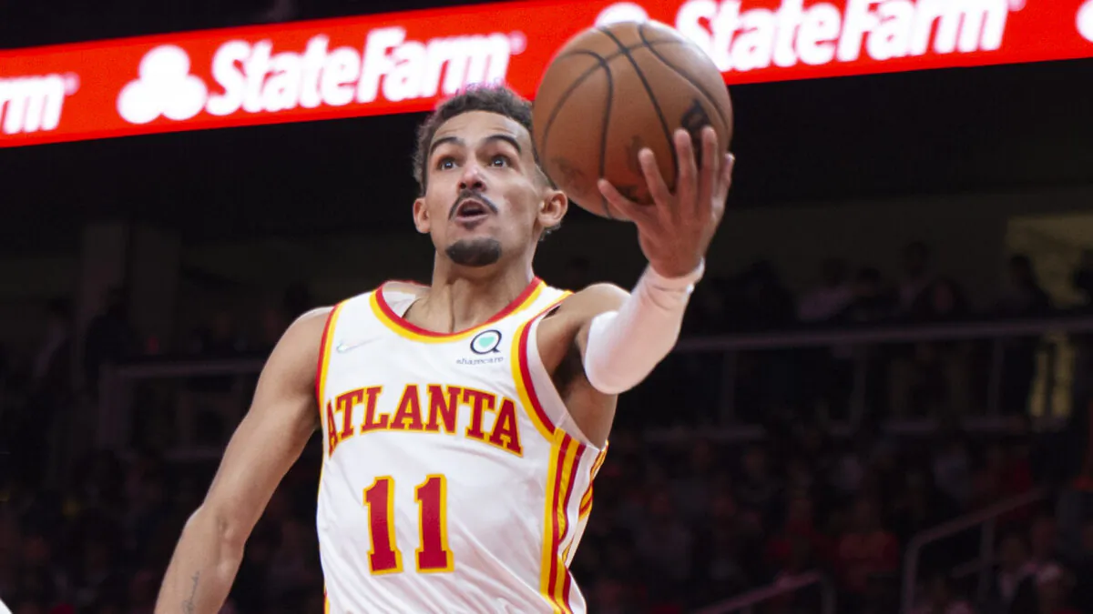 Atlanta Hawks Trae Young (11) scores during the second half of an NBA basketball game against the Milwaukee Bucks in Atlanta, on Nov. 14, 2021. (Hakim Wright Sr./AP Photo)