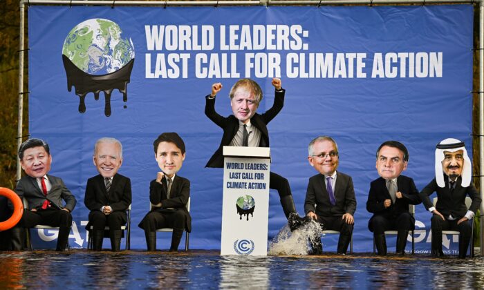 Activists dressed as world leaders demonstrate on a raft on the Forth and Clyde canal during the COP26 climate summit in Glasgow, Scotland, on Nov. 9, 2021. (Jeff J Mitchell/Getty Images)