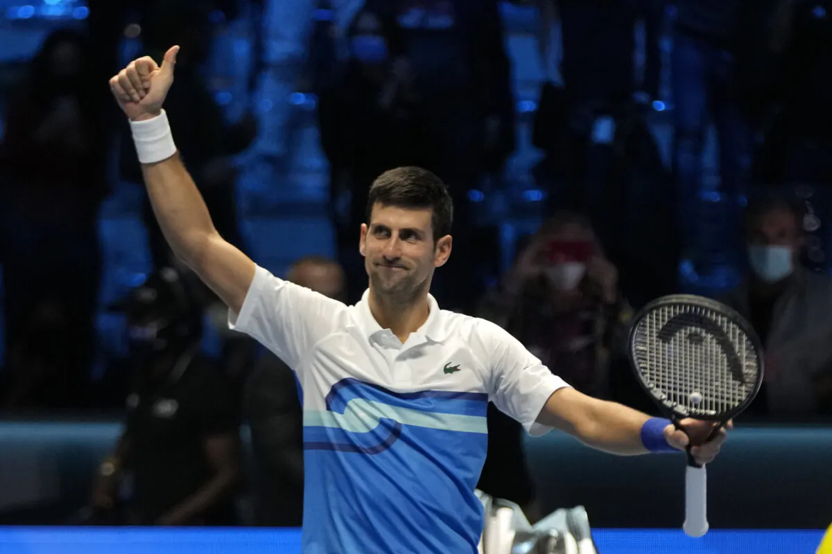 Serbia's Novak Djokovic celebrates after defeating Norways' Casper Ruud during their ATP World Tour Finals singles tennis match, at the Pala Alpitour in Turin, Italy, on Nov. 15, 2021. (Luca Bruno/AP Photo)