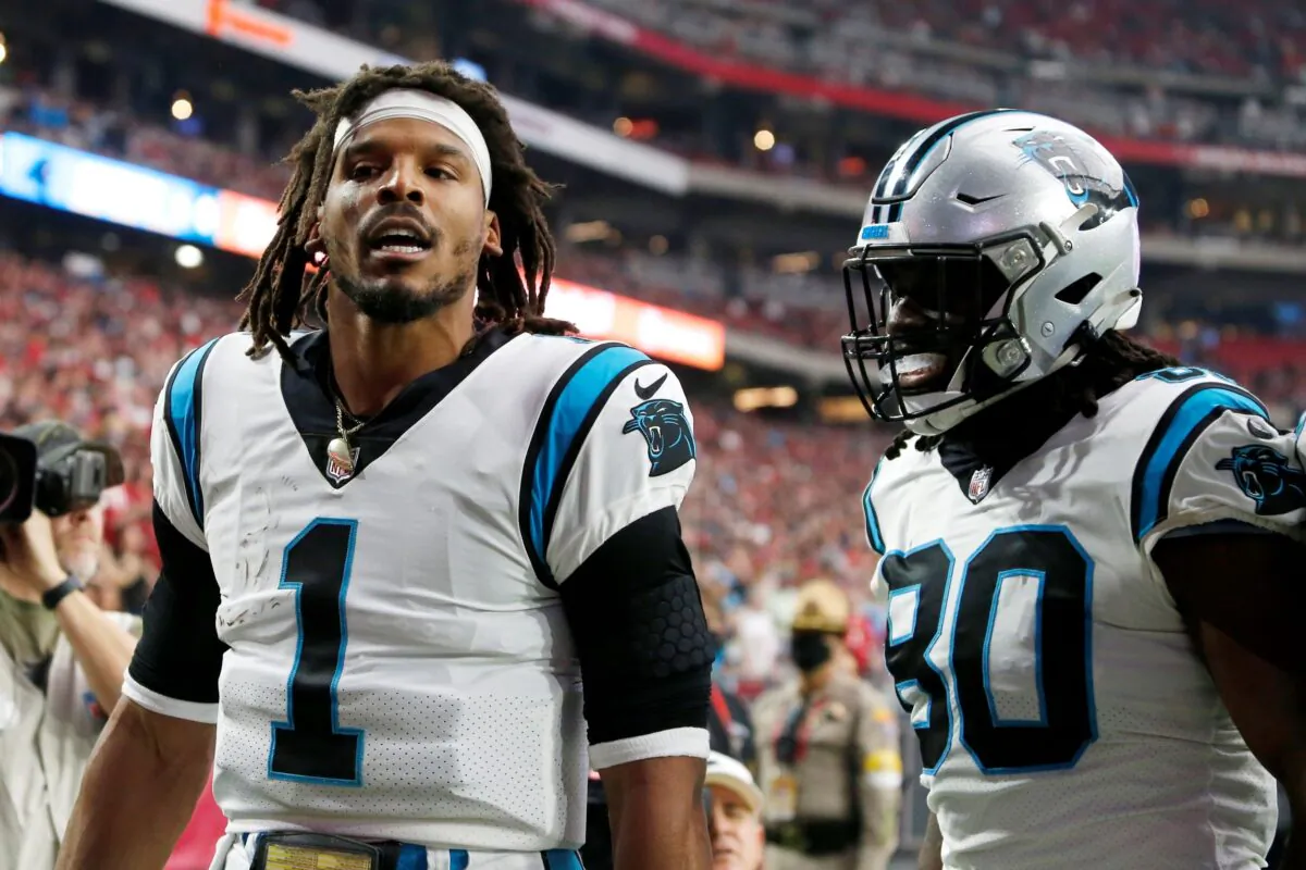 Carolina Panthers quarterback Cam Newton (1) celebrates his touchdown against the Arizona Cardinals with Panthers tight end Ian Thomas (80) during the first half of an NFL football game in Glendale, Ariz., on Nov. 14, 2021. (Ralph Freso/AP Photo)
