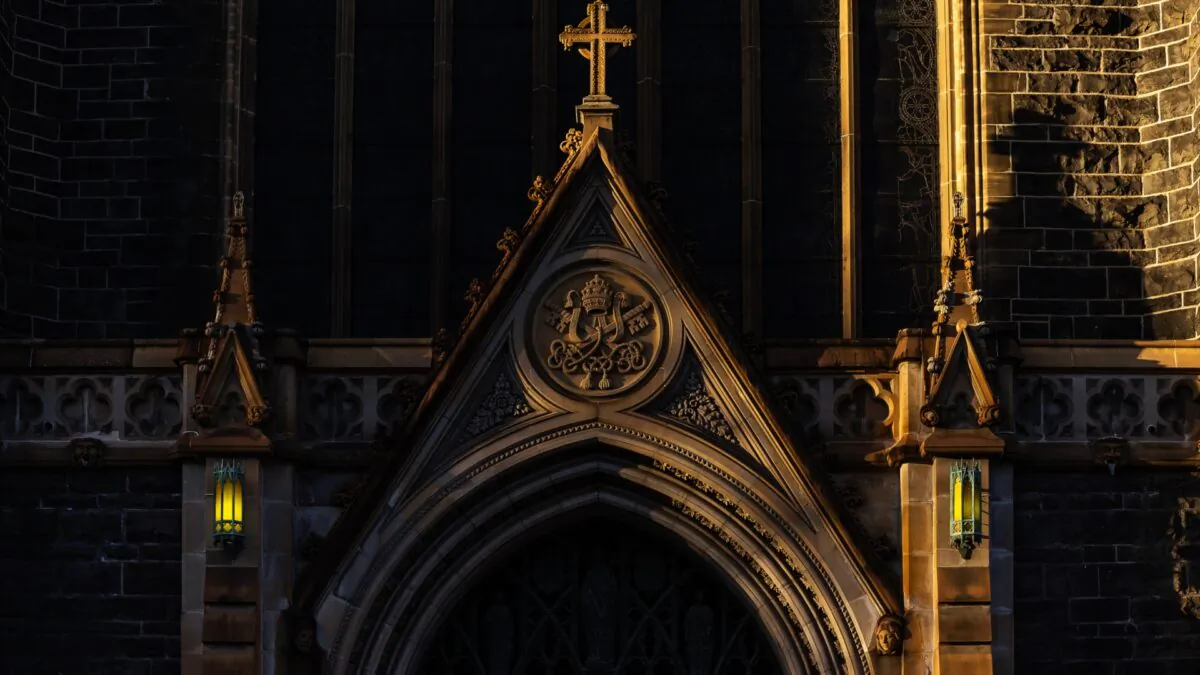 The sun sets on St Patrick's Cathedral in Melbourne, ahead of the new Archbishop of Melbourne, Peter Comensoli, being officially installed to replace the retiring Archbishop of Melbourne, Denis Hart, at a mass, in East Melbourne, Wednesday, Aug. 1, 2018. (AAP Image/Daniel Pockett)