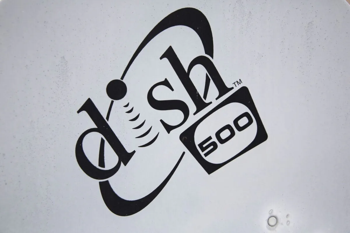 A Dish Network logo is seen on a satellite dish on a Brooklyn apartment building roof in New York, on June 4, 2015. (Brendan McDermid/Reuters)