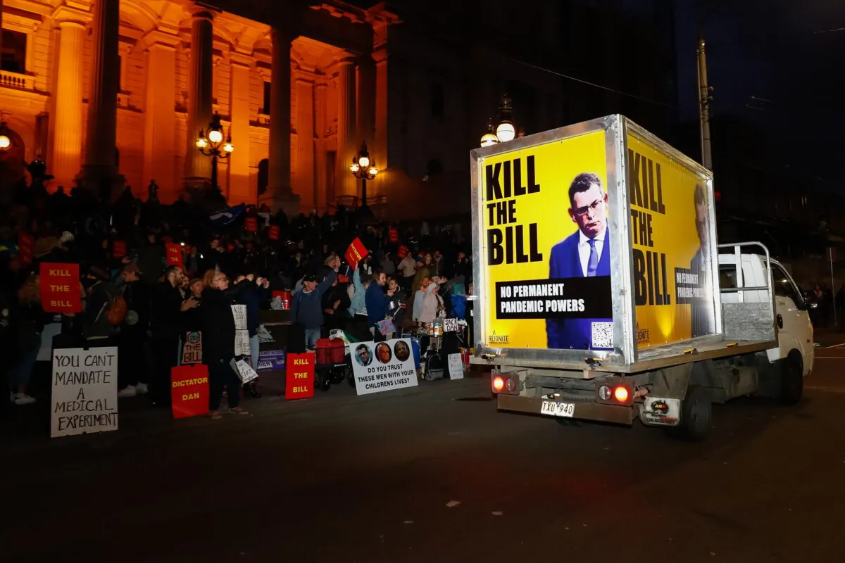 Protestors are seen during a demonstration outside the Victorian State Parliament in Melbourne, on Nov. 15, 2021. (AAP Image/Con Chronis) 