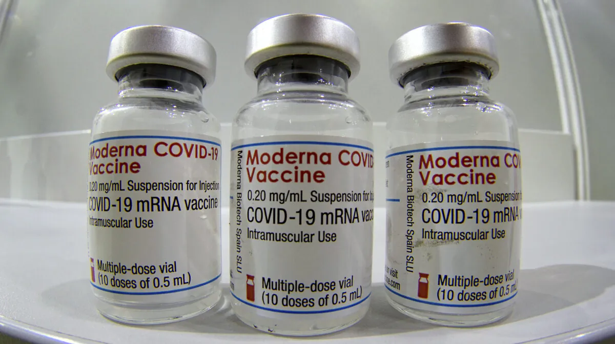 Three vials of the Moderna COVID-19 vaccine are pictured In this file photo dated Feb. 17, 2021. (Michael Sohn/AP)
