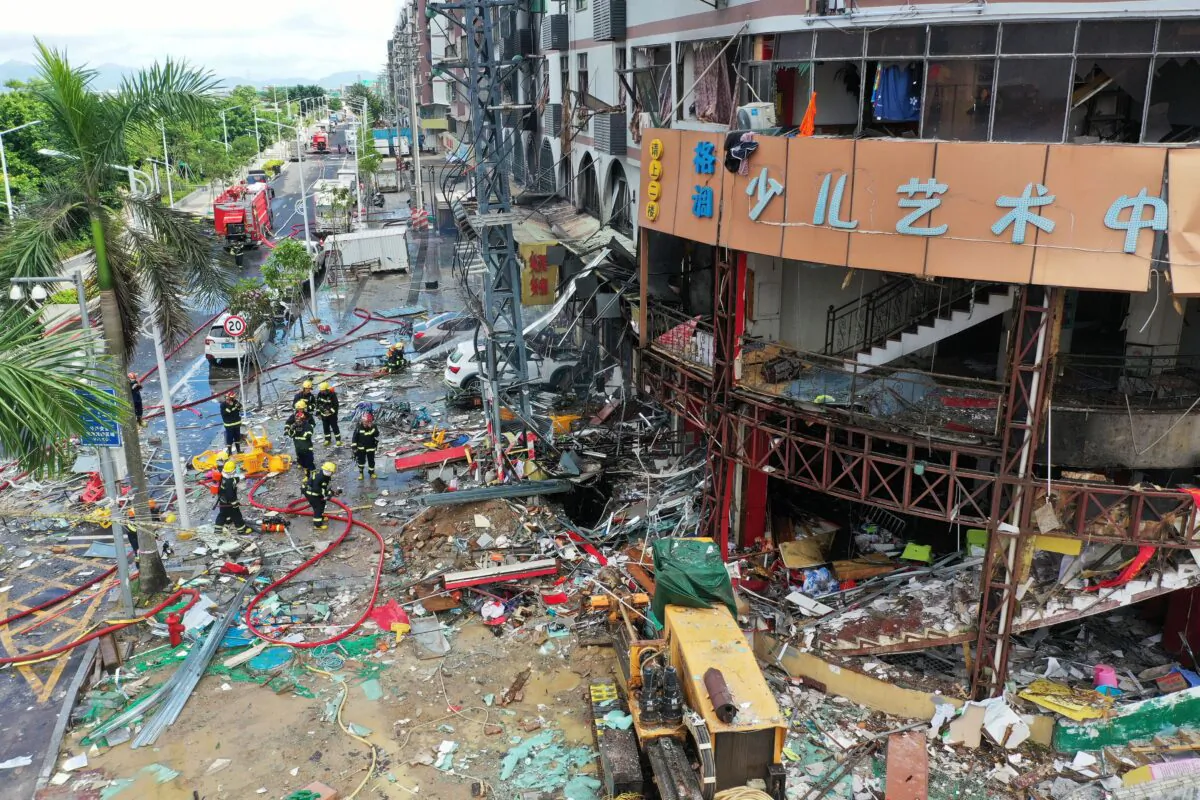 Firefighters work at the scene of a gas pipe explosion in a store in Zhuhai, Guangdong Province, on September 11, 2020. At least three people were injured. (AFP via Getty Images)