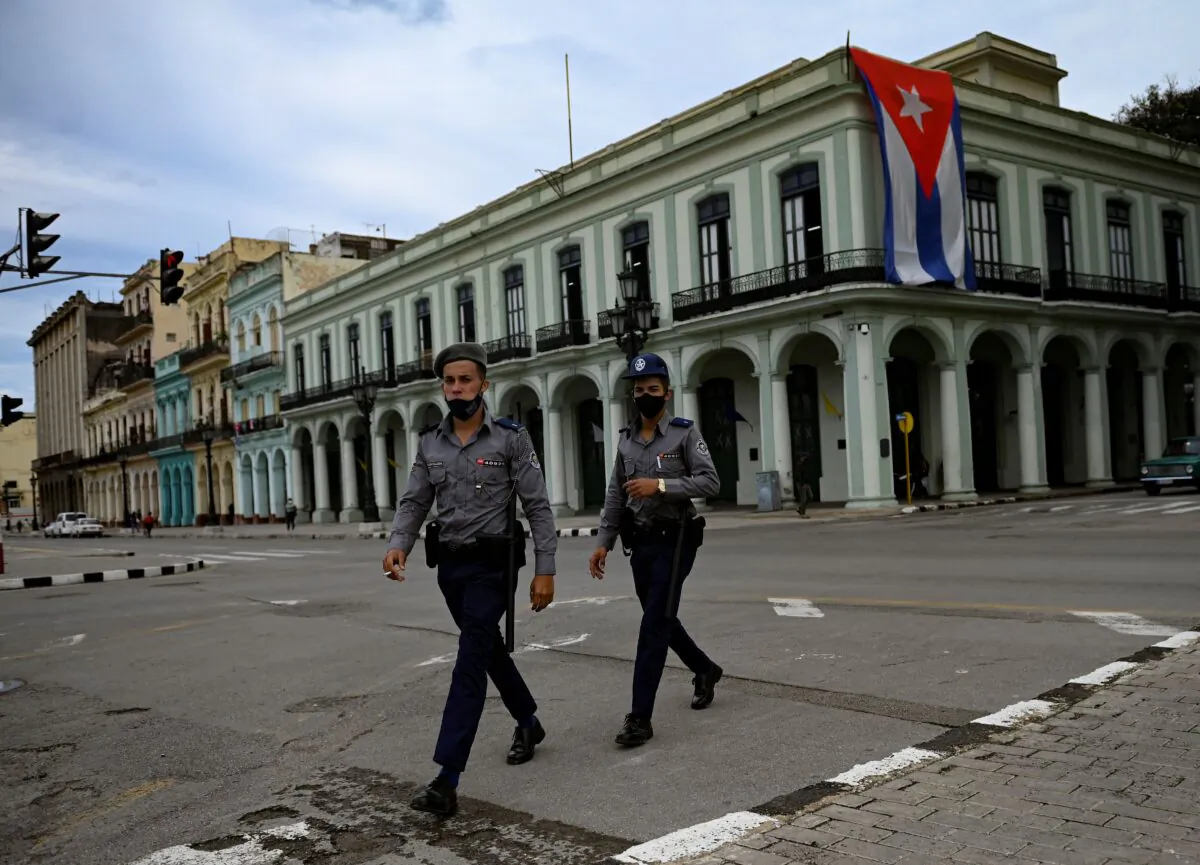 Police officers walk near Havana Capitol in Cuba, on Nov. 15, 2021. (Yamil Lage/AFP via Getty Images)