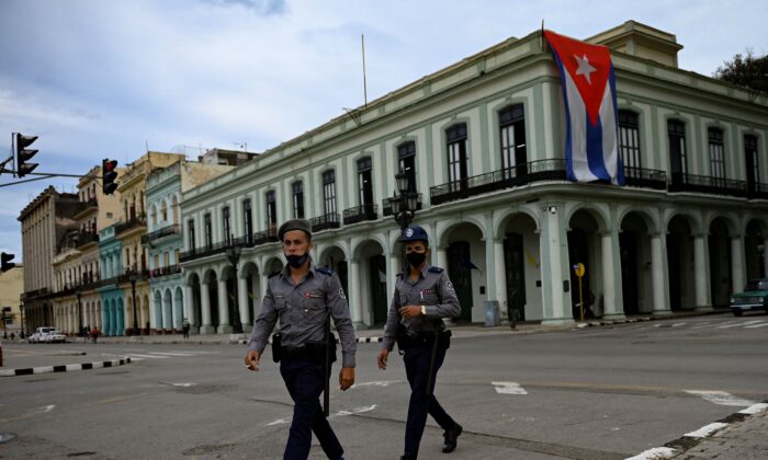 Police officers walk near Havana Capitol in Cuba, on Nov. 15, 2021. (Yamil Lage/AFP via Getty Images)
