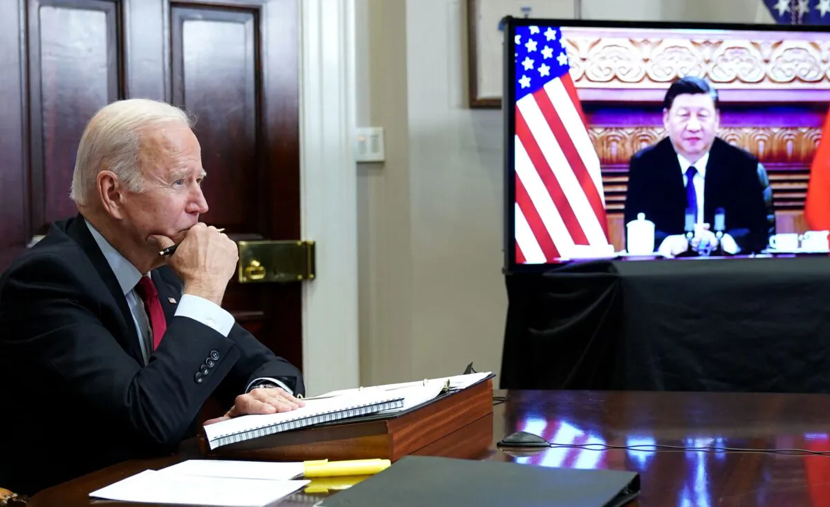 U.S. President Joe Biden meets with Chinese leader Xi Jinping during a virtual summit from the Roosevelt Room of the White House in Washington on Nov. 15, 2021. (Mandel Ngan/AFP via Getty Images)